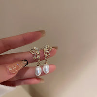 HE5436-925銀針珍珠蝴蝶耳環韓國小眾金屬設計不對稱耳釘個性高級感耳飾